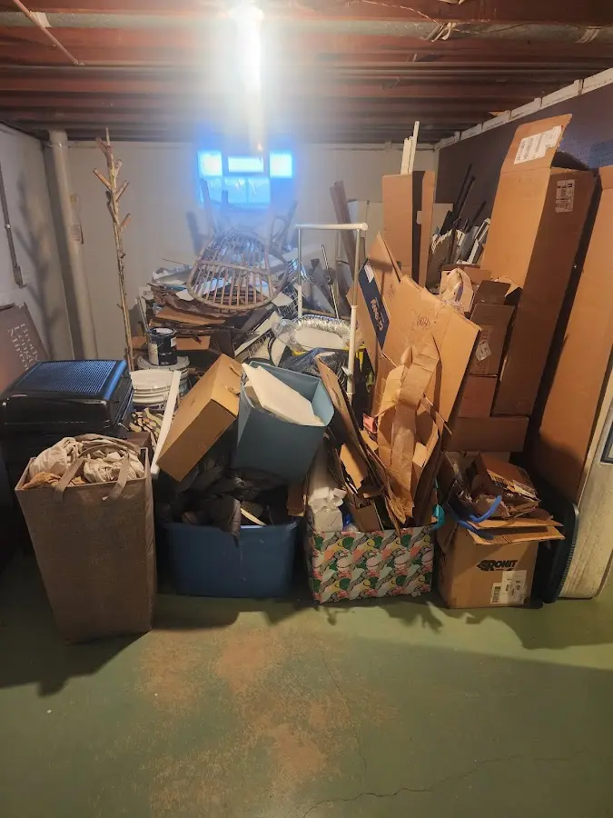 Roll-off dumpster container at job site for 2 Yard Dumpster Rental in Big Lake